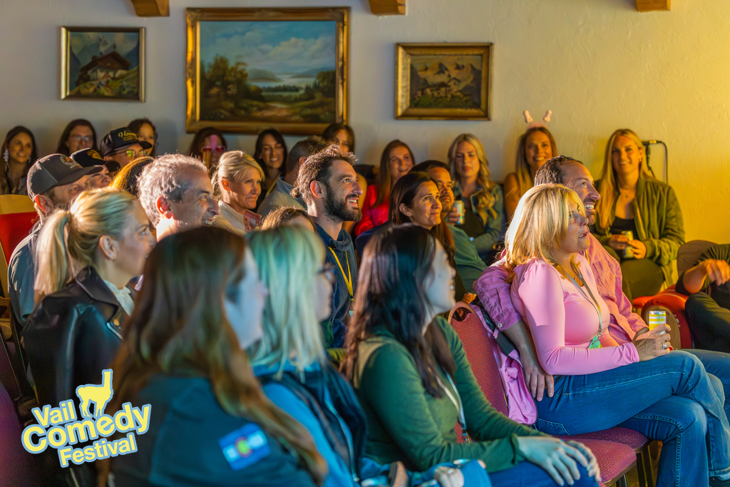 Vail Comedy Festival 2023 - Happy faces in special places.  An audience enjoys live stand-up comedy in a beautiful lounge in an iconic hotel steps from the ski slopes.